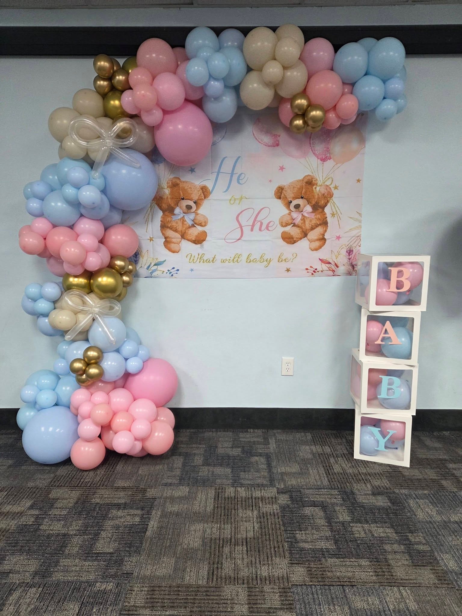 Pink and blue He or She gender reveal balloon arch