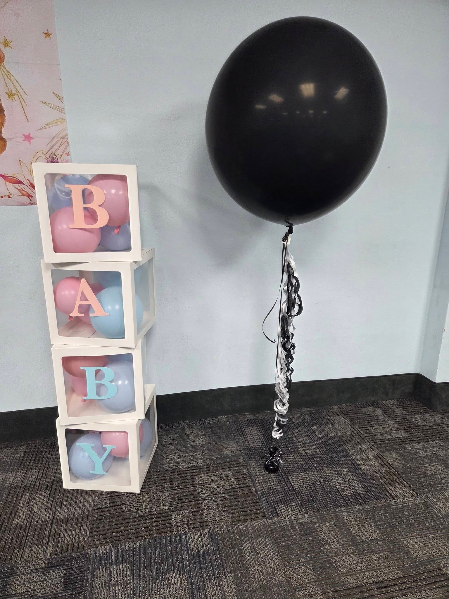 Gender reveal black balloon with BABY letter boxes