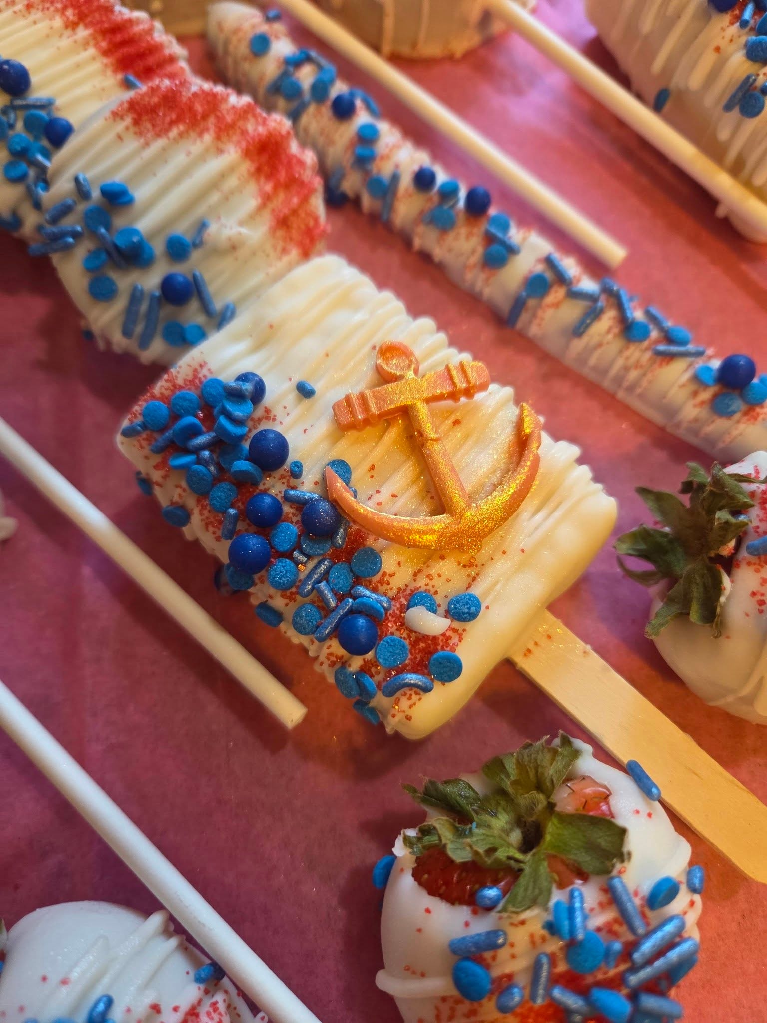Nautical chocolate-dipped treats with blue sprinkles